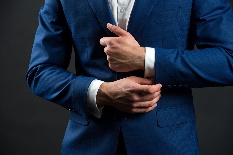 Correct sleeve length. Every detail matters. Jacket perfect fit. Business style formal dress code. Male hands adjusting business suit close up. Formal style. Business people choose formal clothing